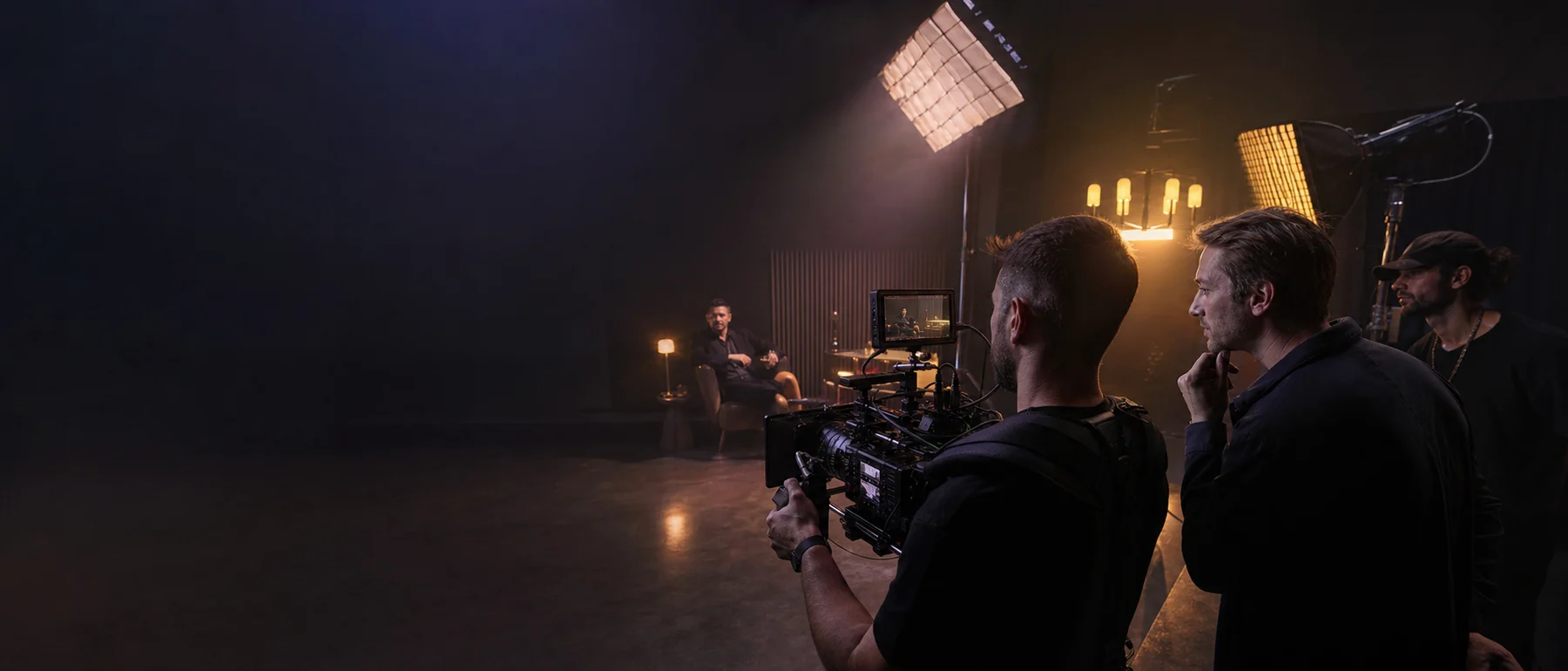 Cinematographer and director filming a commercial scene on a professional set